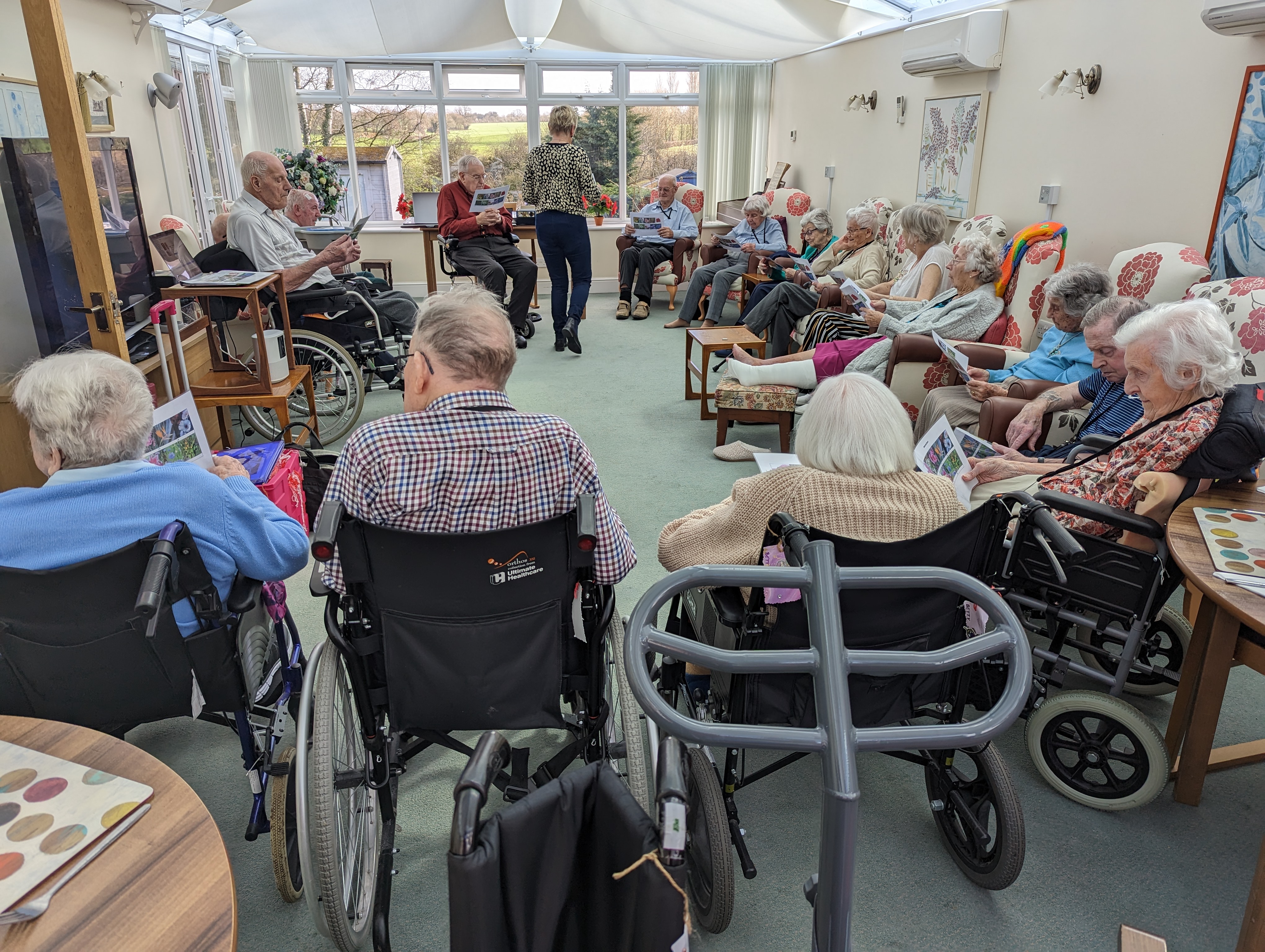 Care home residents in communal area